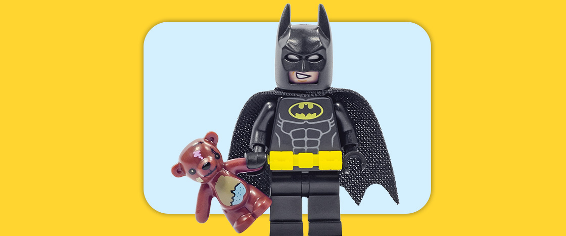 Image of Lego Batman holding a teddy bear