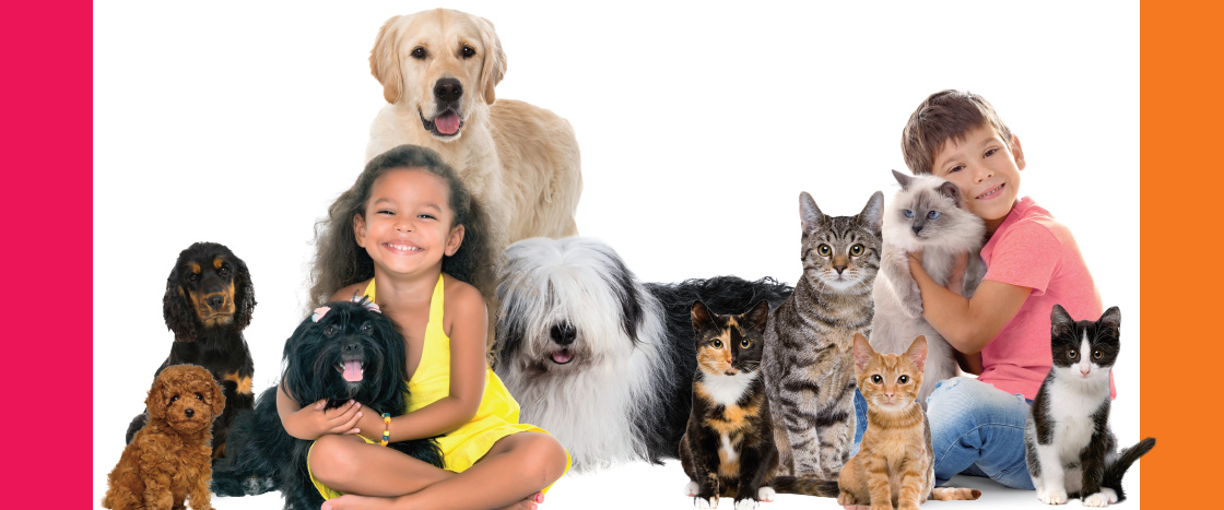 Image of two kids posing with a group of dogs and cats