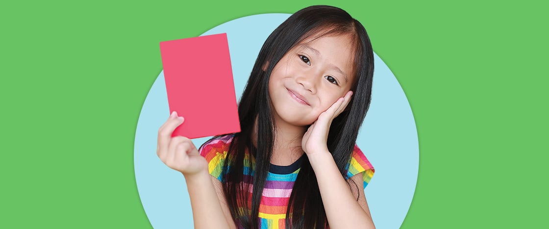 Image of student holding up piece of paper